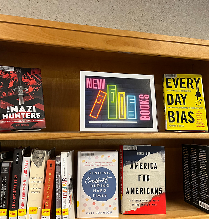 The New Books shelf in the MWCC Library.